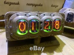 Nixie Tube Clock in a plastic case in the steampunk style on gas lamps